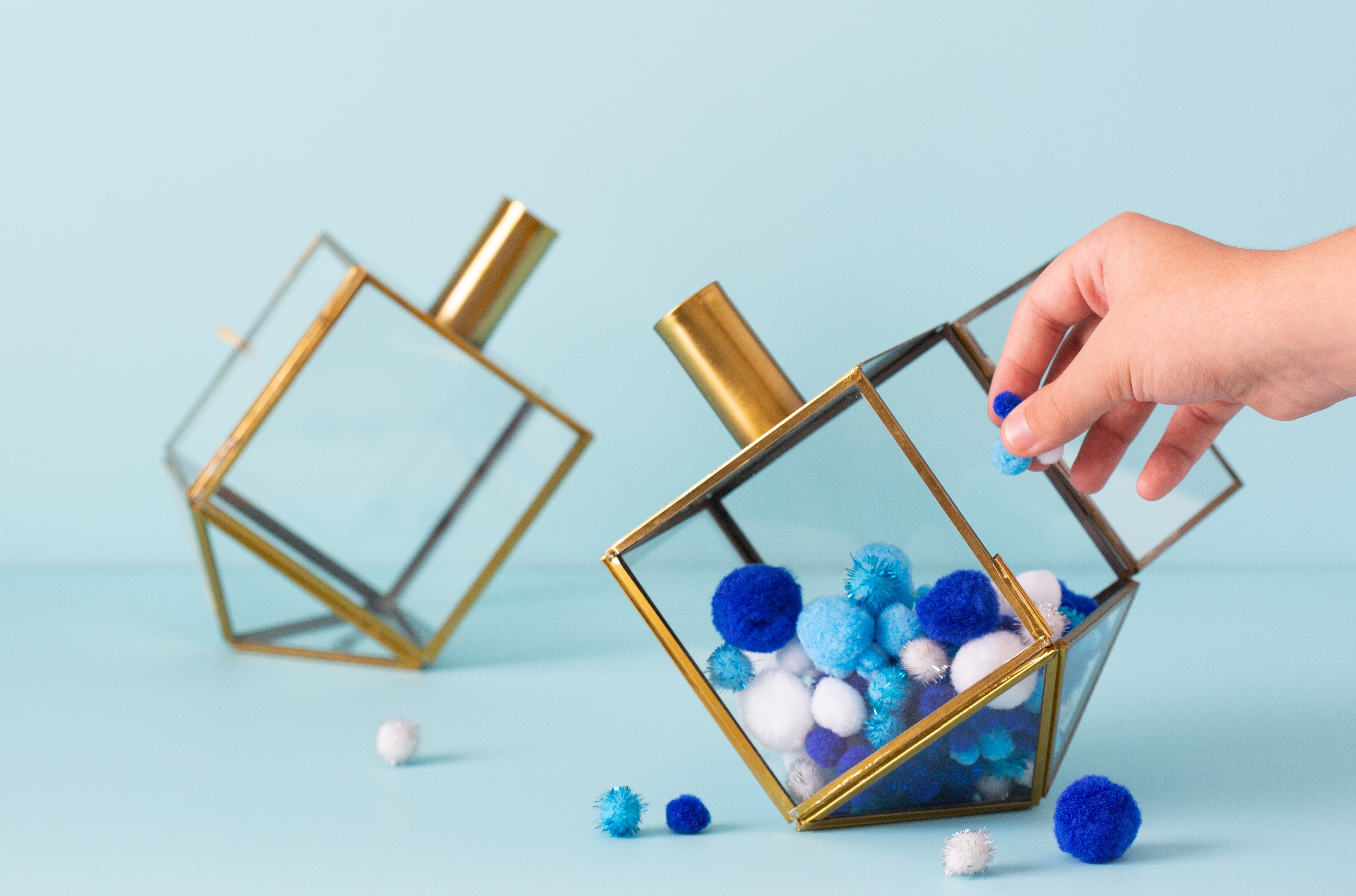 Glass and gilded metal dreidel terrariums for Hanukkah and Jewish decorations